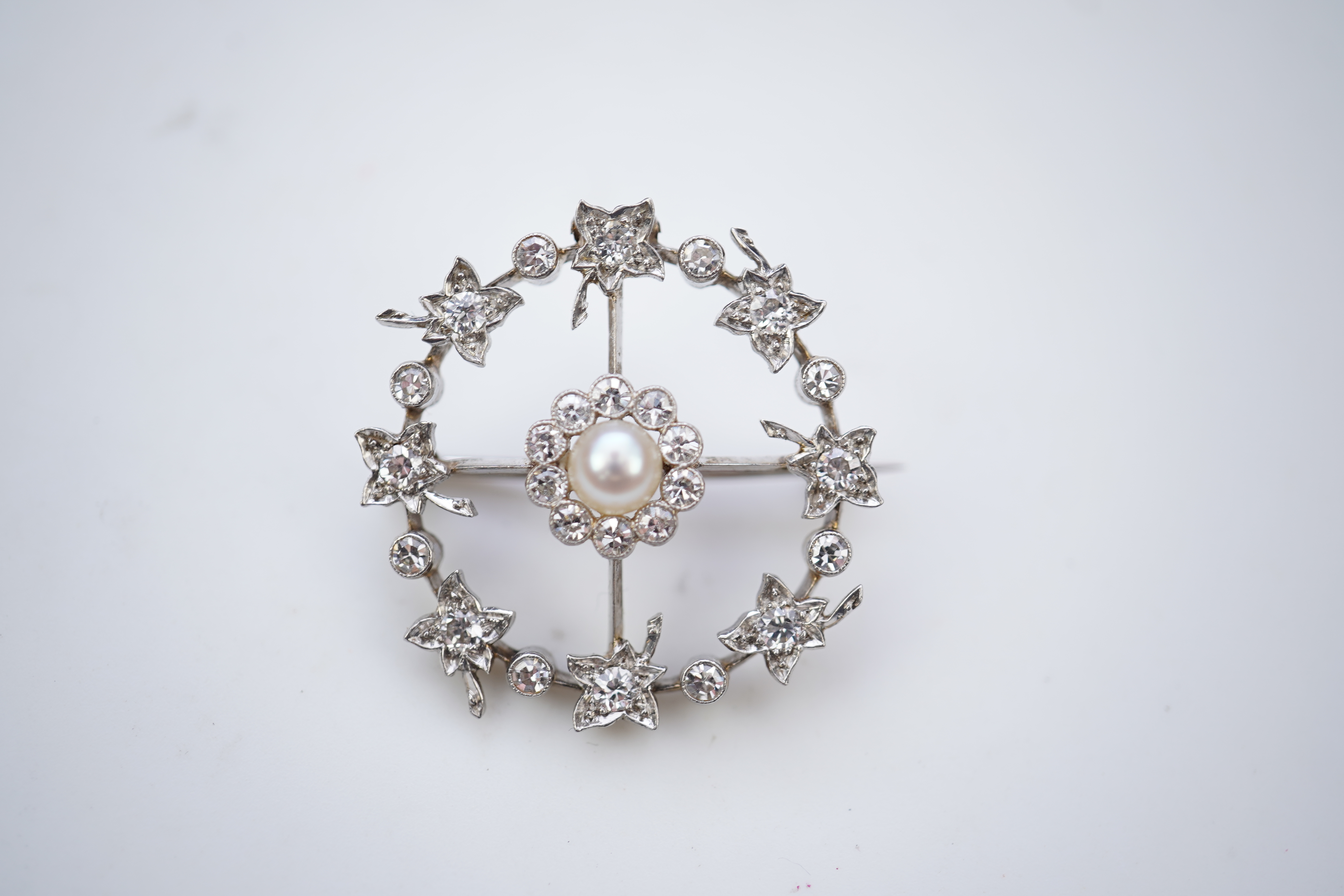 An attractive Edwardian pearl and diamond brooch, circa 1910